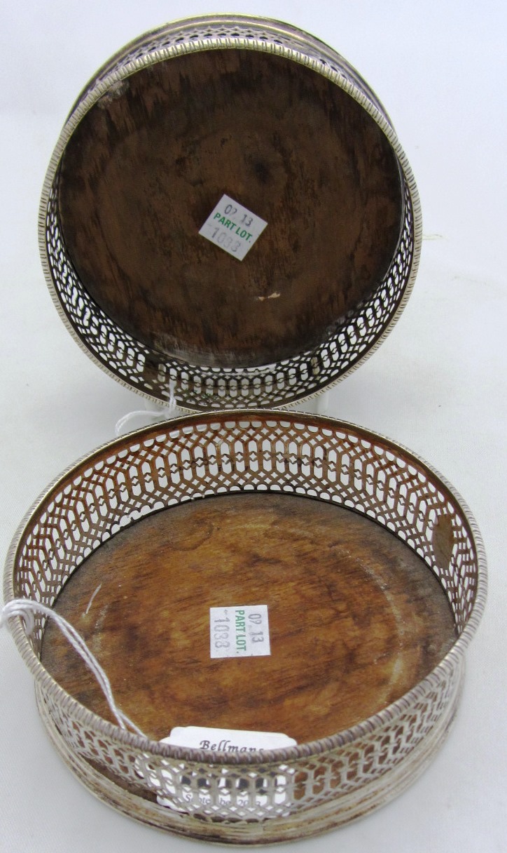 Appraisal: A pair of George III silver mounted bottle coasters each