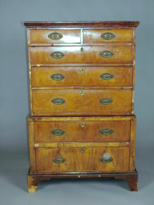 Appraisal: A walnut chest on chest mid- th century with ogee