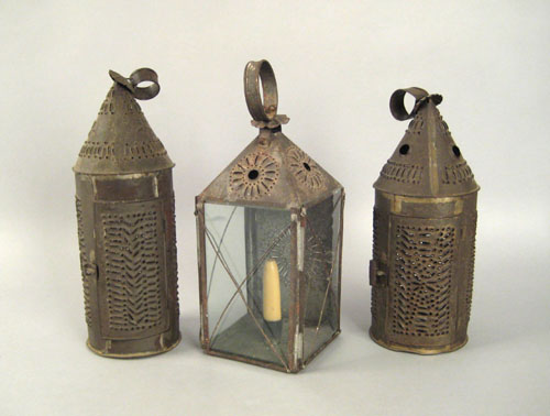 Appraisal: Three tin lanterns th c with pierced decoration h h