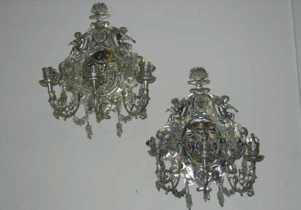 Appraisal: PAIR OF ENGLISH PLATED SILVER WALL SCONCES Elaborately decorated each