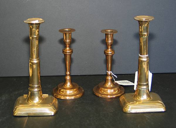 Appraisal: Two pairs of bell metal candlesticks th century The first