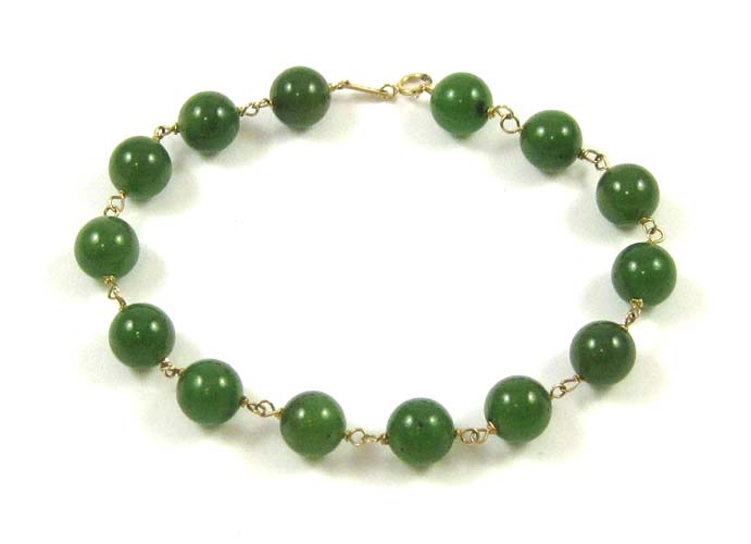 Appraisal: JADE AND FOURTEEN KARAT GOLD BRACELET measuring - inches in