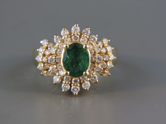 Appraisal: Emerald and Diamond Ring fine oval gem weighing carat surrounded