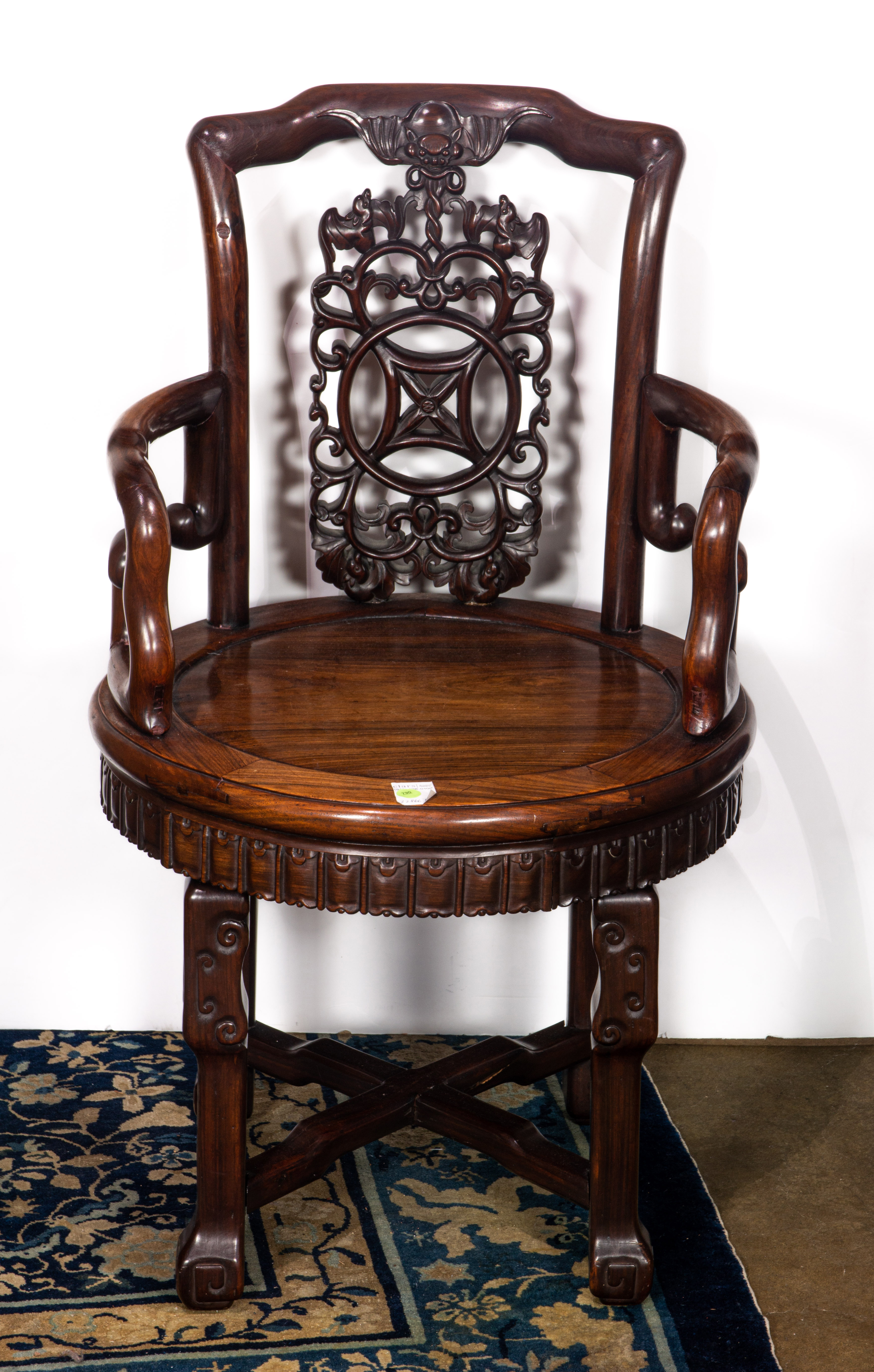 Appraisal: CHINESE HARDWOOD SWIVELING ARMCHAIR Chinese hardwood swiveling armchair h x