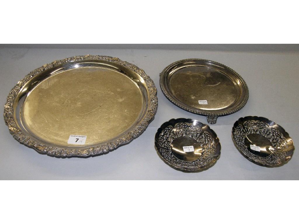 Appraisal: Circular salver with high relief foliate border on three bun