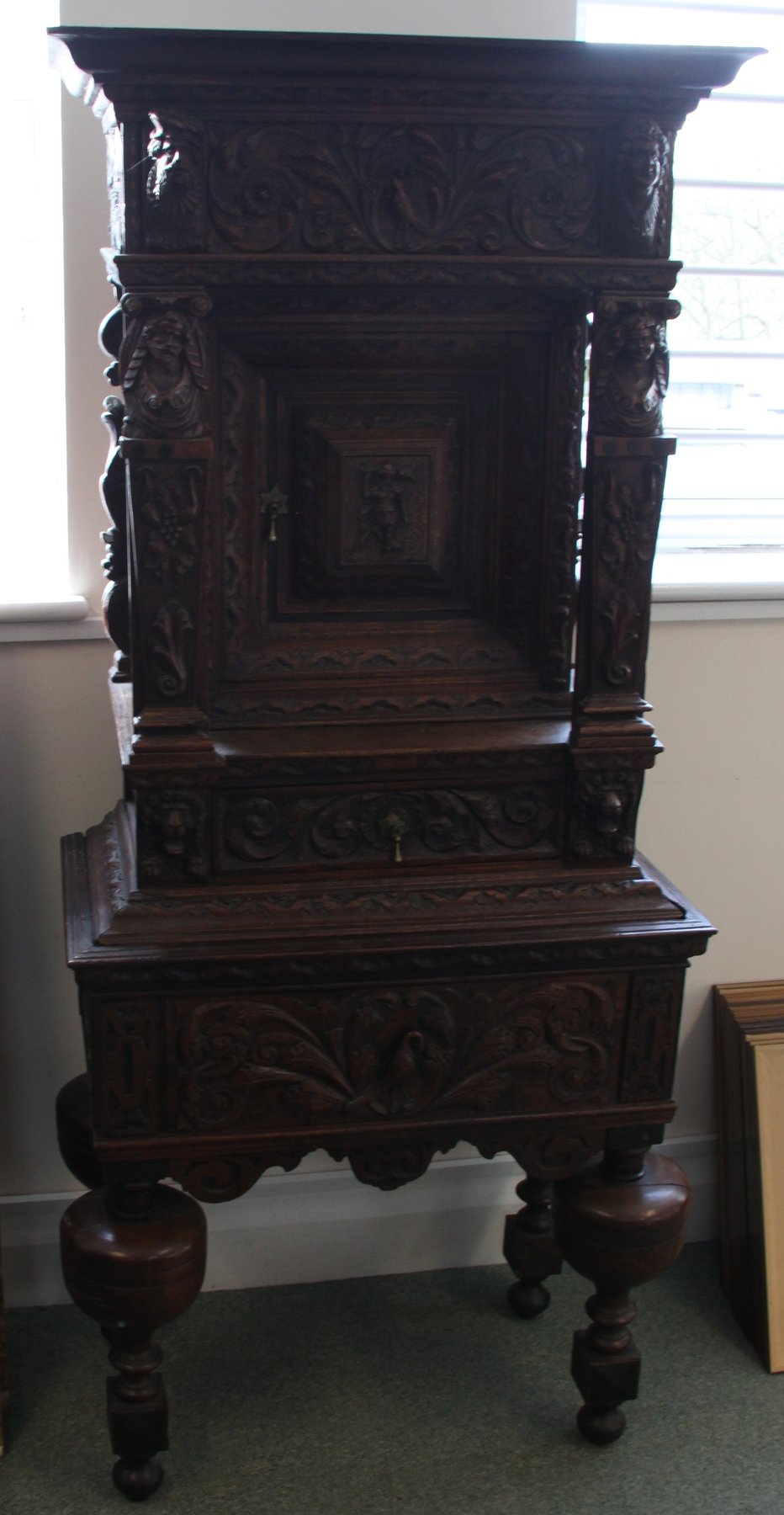 Appraisal: A late th Century Continental carved oak cupboard the frieze