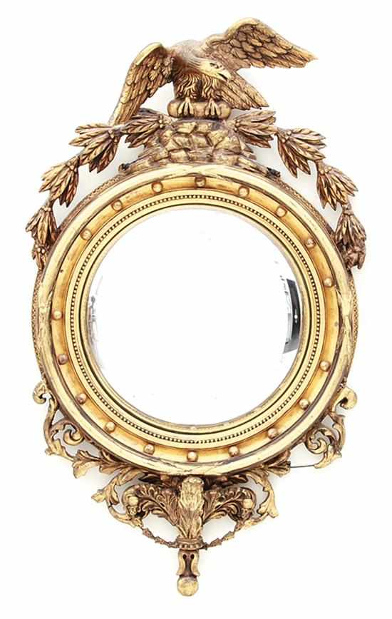 Appraisal: Carved giltwood convex mirror first half th century eagle with