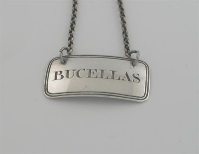 Appraisal: A George III wine label with reeded borders inscribed 'BUCELLAS'