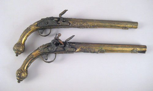 Appraisal: Pair of Middle Eastern brass flintlock pistols approx caliber barrel