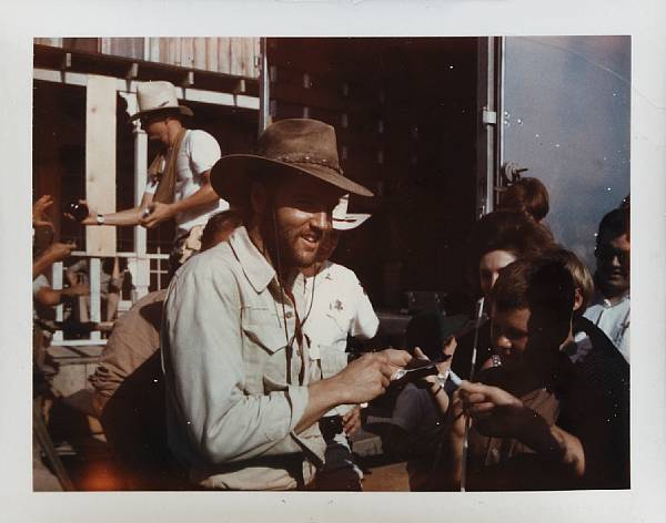 Appraisal: An Elvis Presley signed color snapshot Showing the King standing