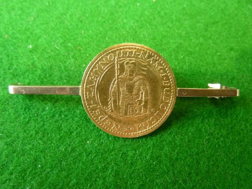 Appraisal: A gold Czech coin dated mounted as a bar brooch