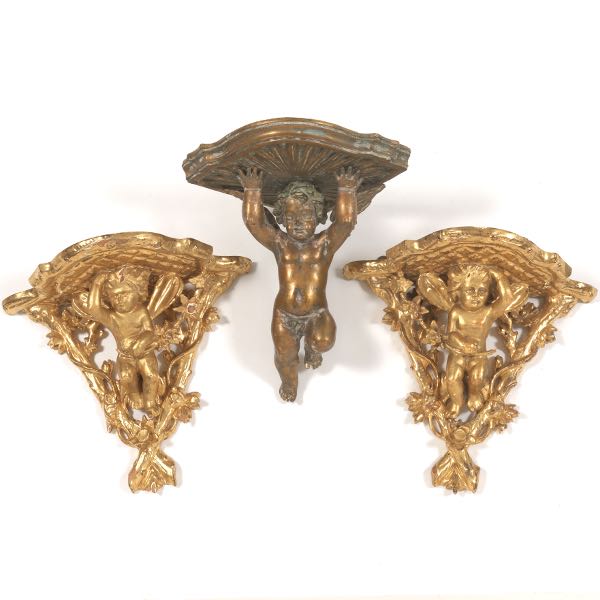 Appraisal: THREE GILT CHERUB WALL SCONCES Two measuring H x W