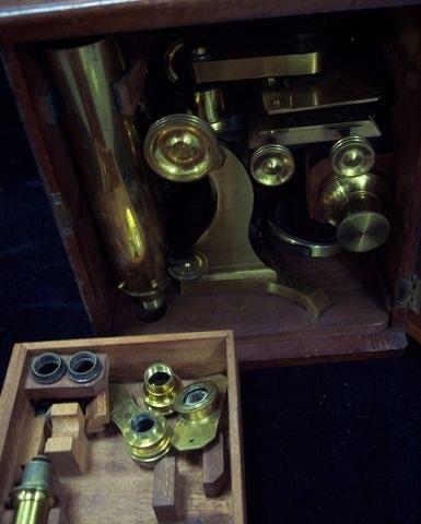 Appraisal: A brass microscope in a fitted mahogany case complete with