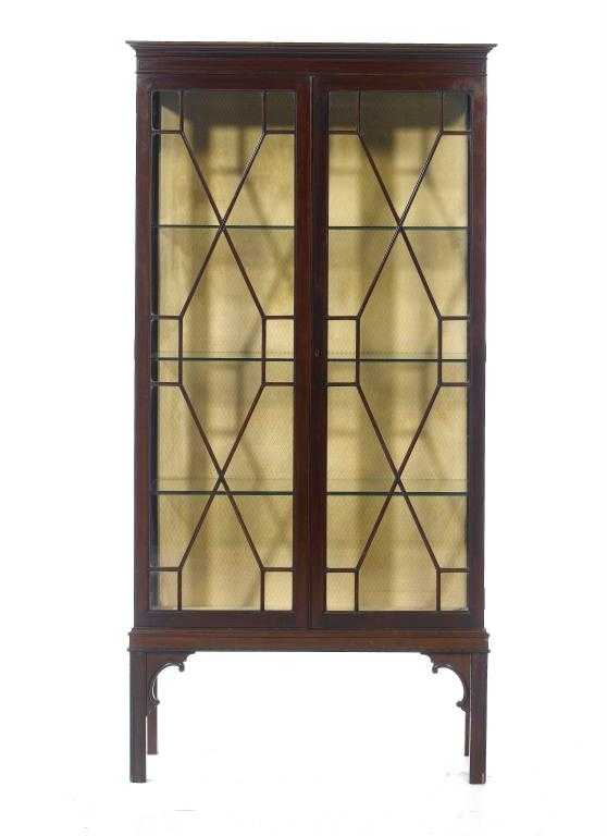 Appraisal: A MAHOGANY CHINA CABINET with cavetto cornice and beaded frieze