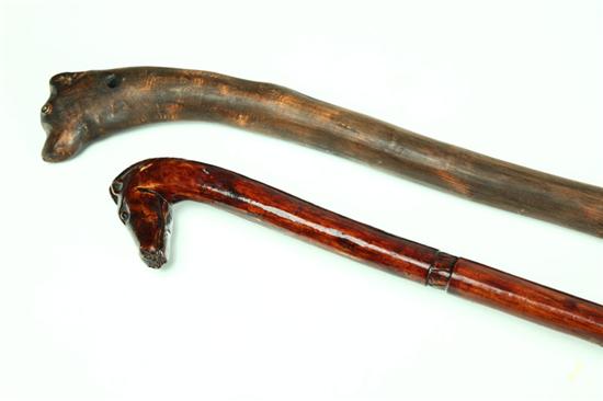 Appraisal: TWO FOLK ART CANES American late th-early th century wood