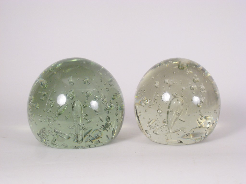 Appraisal: Two large bottle glass Dumps or Door Stops with bubble