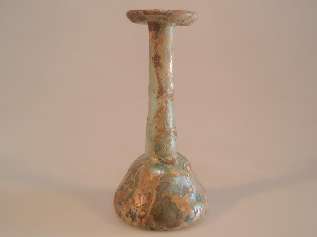 Appraisal: A Roman light green glass 'candlestick' unguentarium the everted tubular