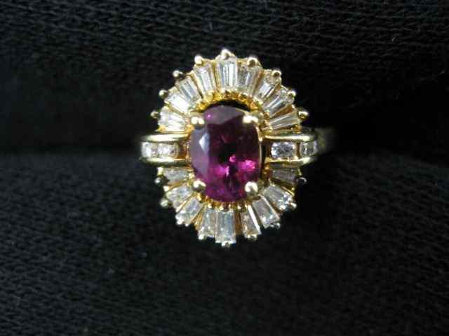 Appraisal: Ruby Diamond Ring oval rich gem weighing carats surrounded by