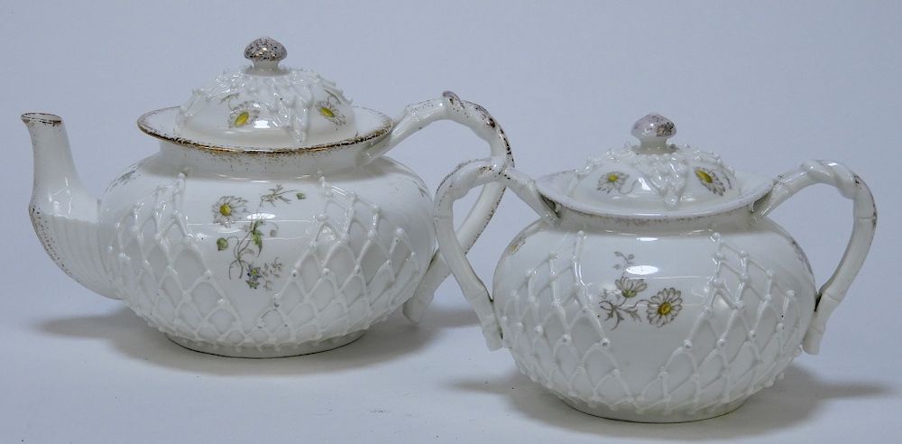 Appraisal: PC Lotus Ware Porcelain Teapot Sugar Bowl Set United States