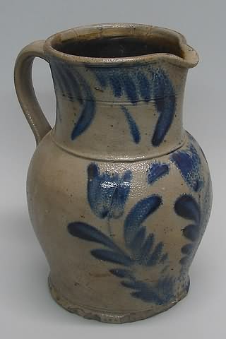 Appraisal: Pitcher featuring tulip and leaf design t cracks and repairs