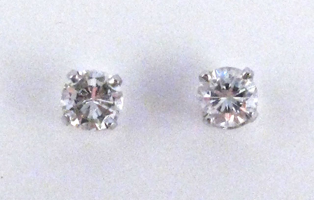 Appraisal: PAIR OF DIAMOND AND FOURTEEN KARAT WHITE GOLD EARSTUDS individually