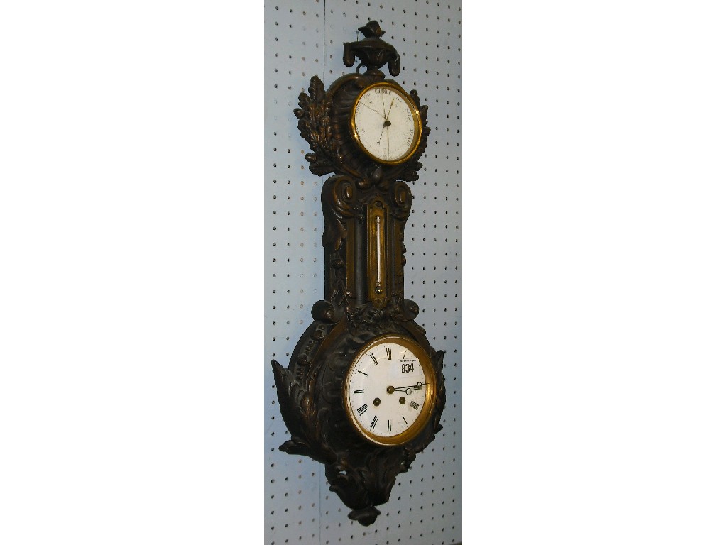 Appraisal: Cartel style two train clock barometer the movement striking on