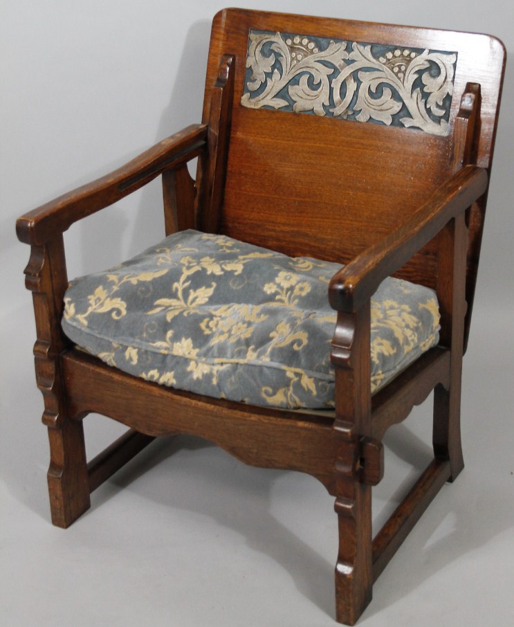 Appraisal: A 's oak folding chair with articulated back loose cushion