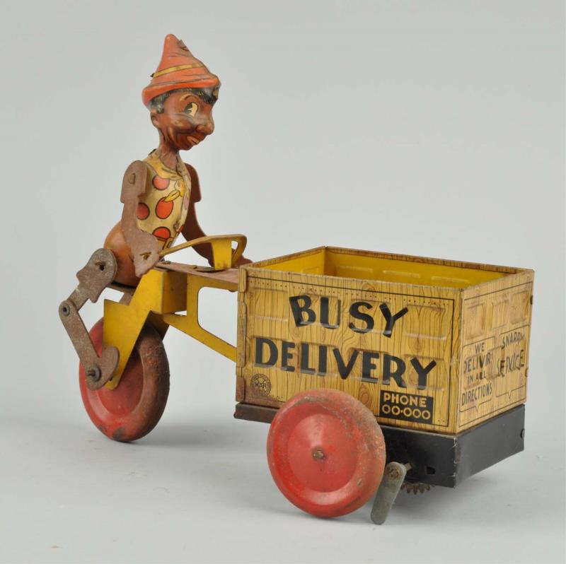 Appraisal: Tin Litho Wind-Up Busy Delivery Toy Made by Marx Depicts