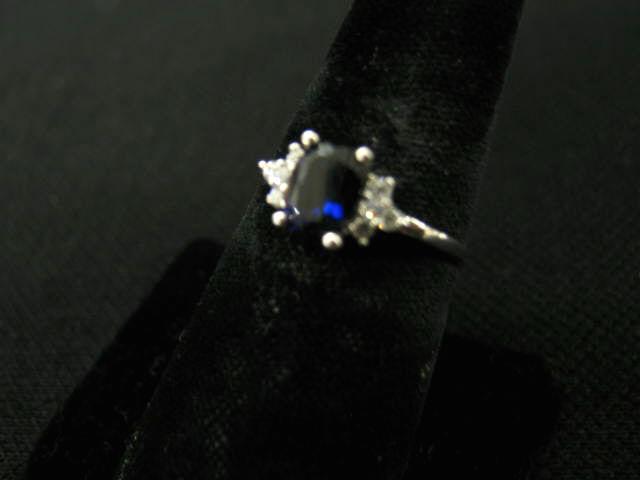 Appraisal: Sapphire Diamond Ring deep blue oval gem carat with four