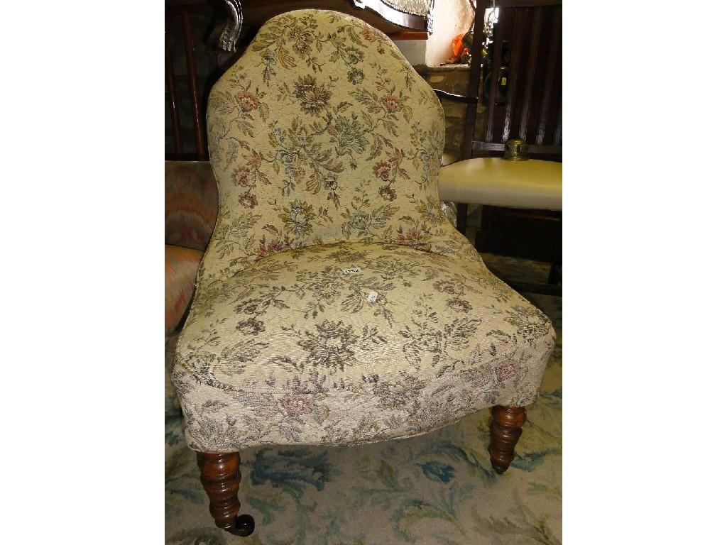 Appraisal: An Edwardian nursing chair with floral upholstered seat and shaped