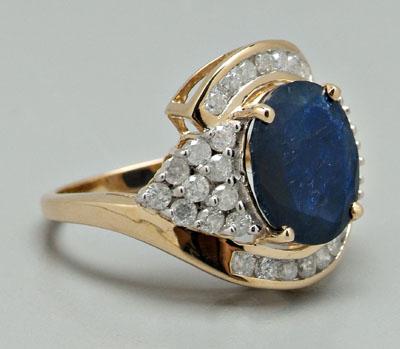 Appraisal: Sapphire and diamond ring oval faceted blue sapphire estimated weight