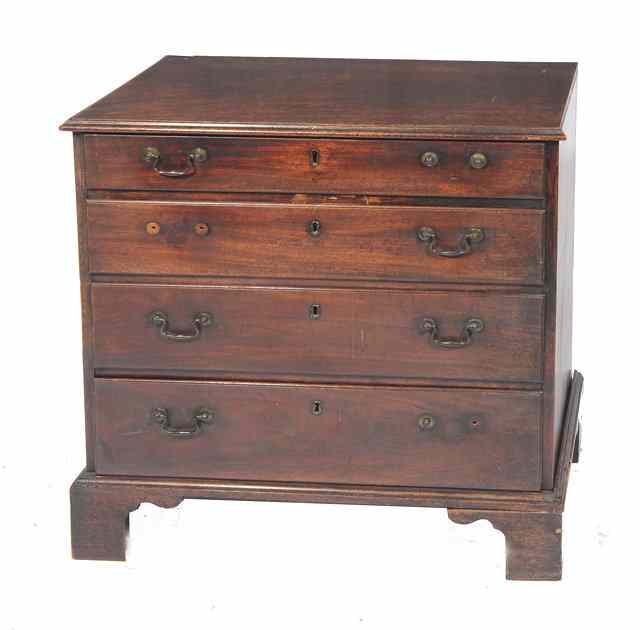 Appraisal: A GEORGE III MAHOGANY SMALL CHEST of four graduated long