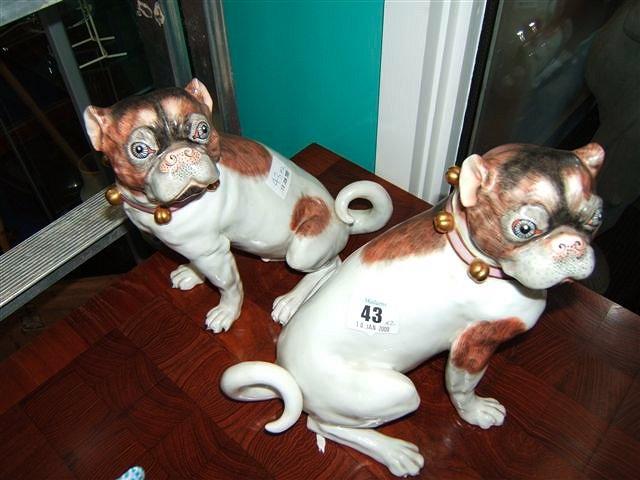 Appraisal: A pair of Dresden hand painted porcelain pug dogs each