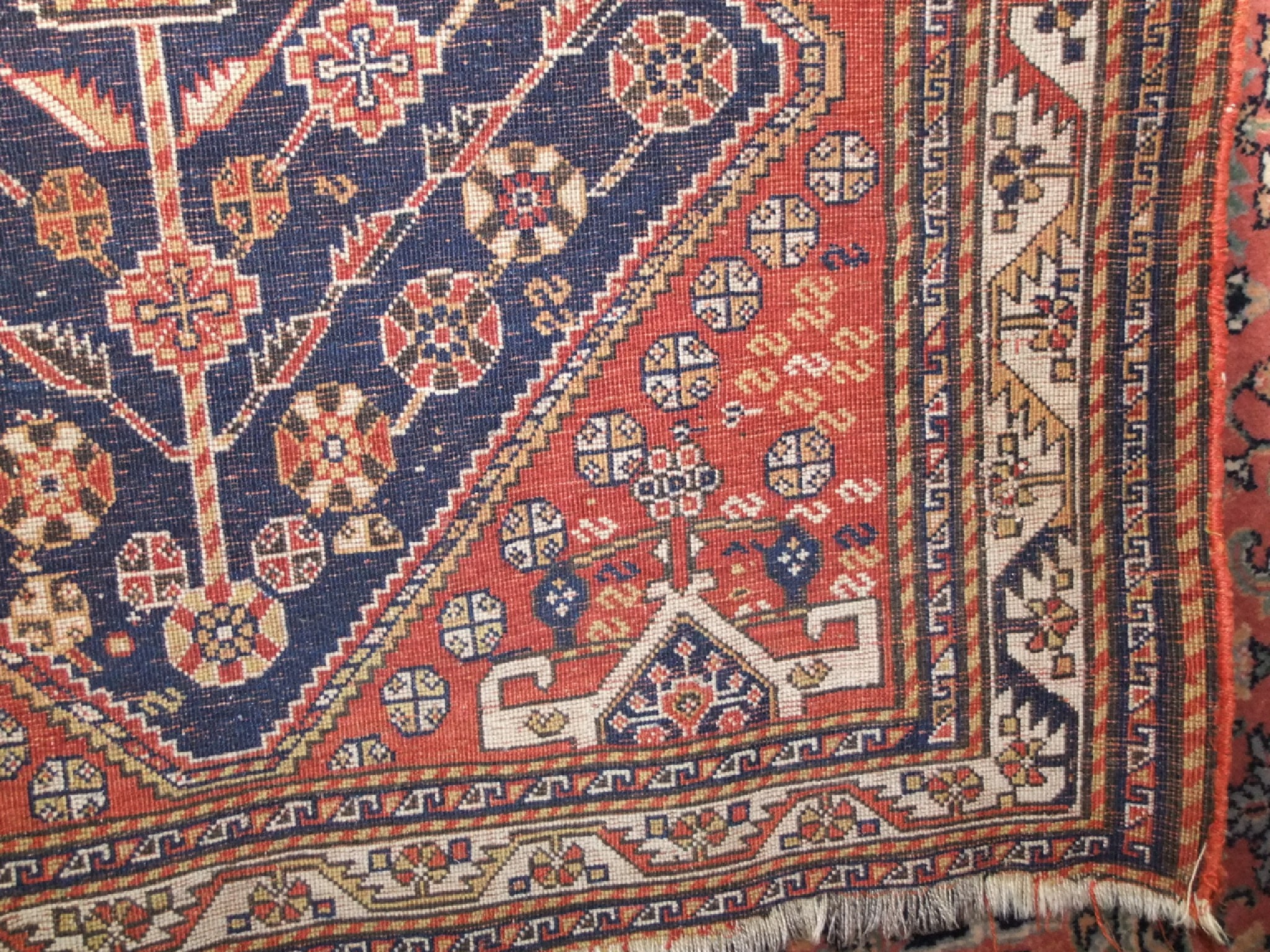 Appraisal: An eastern wool work rug the brick red ground interspersed