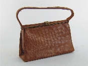 Appraisal: A tan brown crocodile lady's handbag Art Deco style goldtone