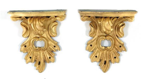 Appraisal: Pair Continental carved giltwood brackets late th century shaped top