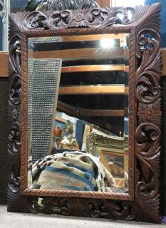 Appraisal: Rococo style carved wood framed mirror Rococo style carved wood