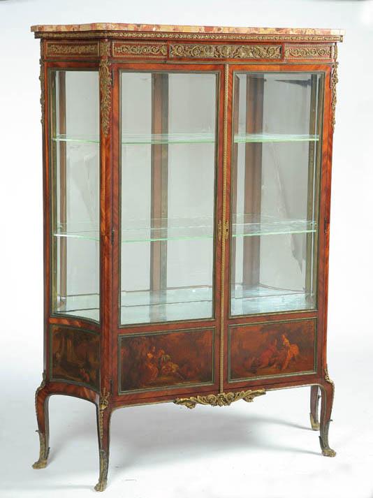 Appraisal: FRENCH-STYLE CURIO CABINET Twentieth century mixed woods glass marble Elaborate