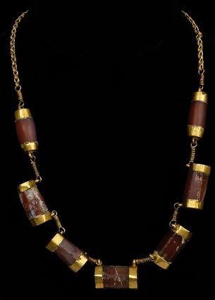 Appraisal: EARLY PERSIAN CARNELIAN AND GOLD NECKLACE in beads approx in