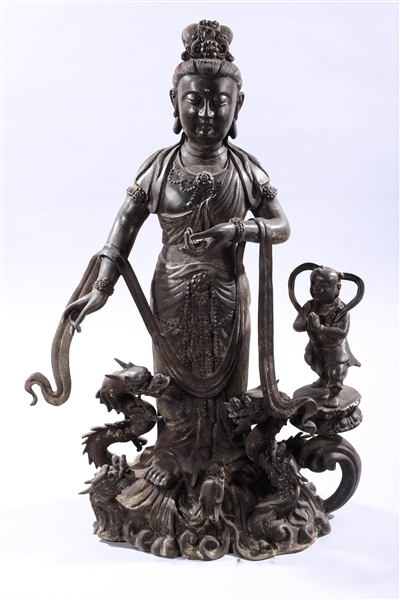 Appraisal: Chinese bronze Guanyin standing atop dragons with attendants x x