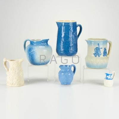 Appraisal: GLAZED STONEWARE Four pitchers together with two Parian ware porcelain