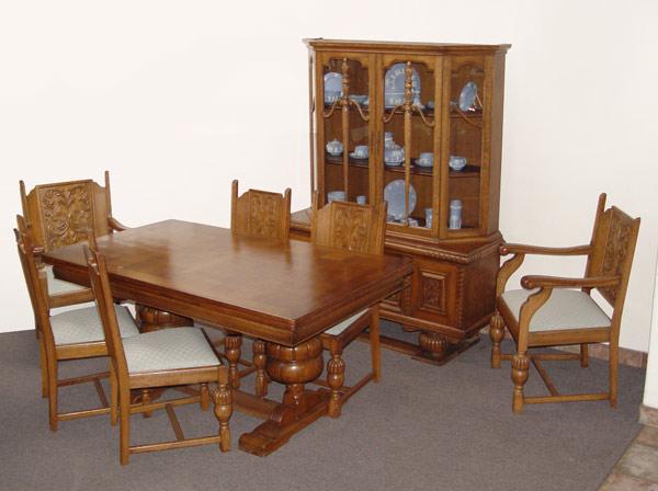 Appraisal: BELGIAN OAK CARVED DINING TABLE CHAIRS AND CHINA CABINET 'S