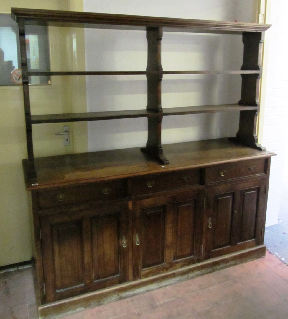 Appraisal: An th century design mahogany freestanding oak dresser the open