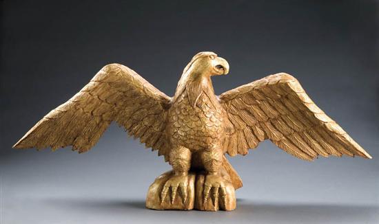 Appraisal: CARVED AND GILT EAGLE Twentieth century hardwood Spread-winged eagle perched