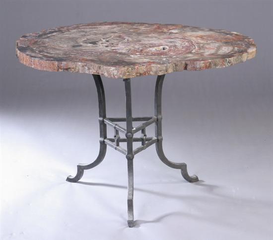 Appraisal: ARAUCARIOSYLON ARIZONICUM PETRIFIED WOOD TABLE th century Together with iron