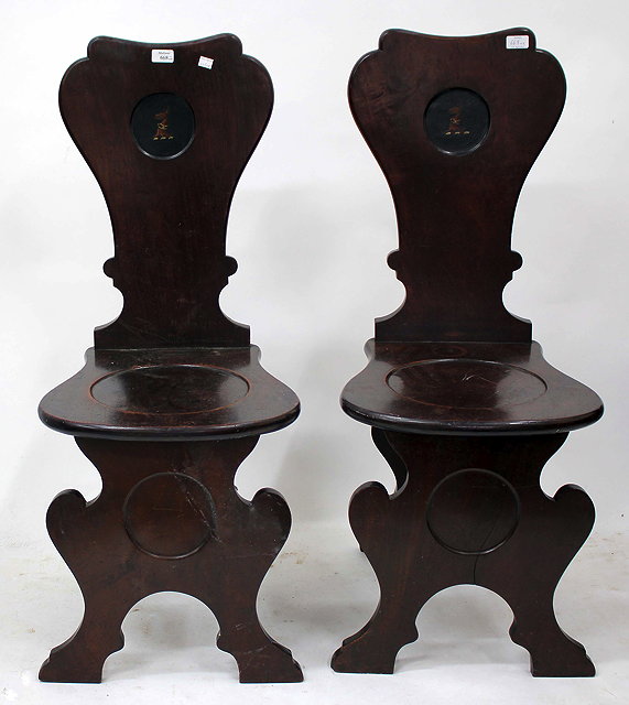 Appraisal: A PAIR OF GEORGE III MAHOGANY HALL CHAIRS each with