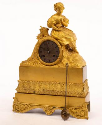 Appraisal: A French gilt metal mounted mantel clock the surmount modelled