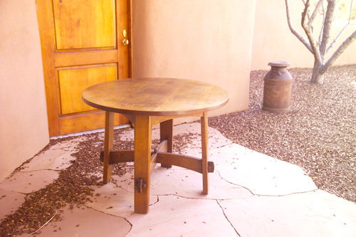 Appraisal: GUSTAV STICKLEY Library table with a circular top over arched