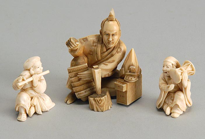 Appraisal: THREE IVORY FIGURES Armor maker and Daikoku and Ebisu playing