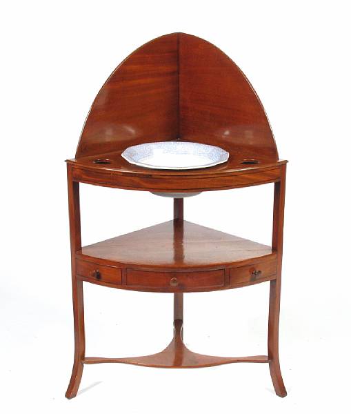 Appraisal: A George III mahogany bow front corner wash stand height